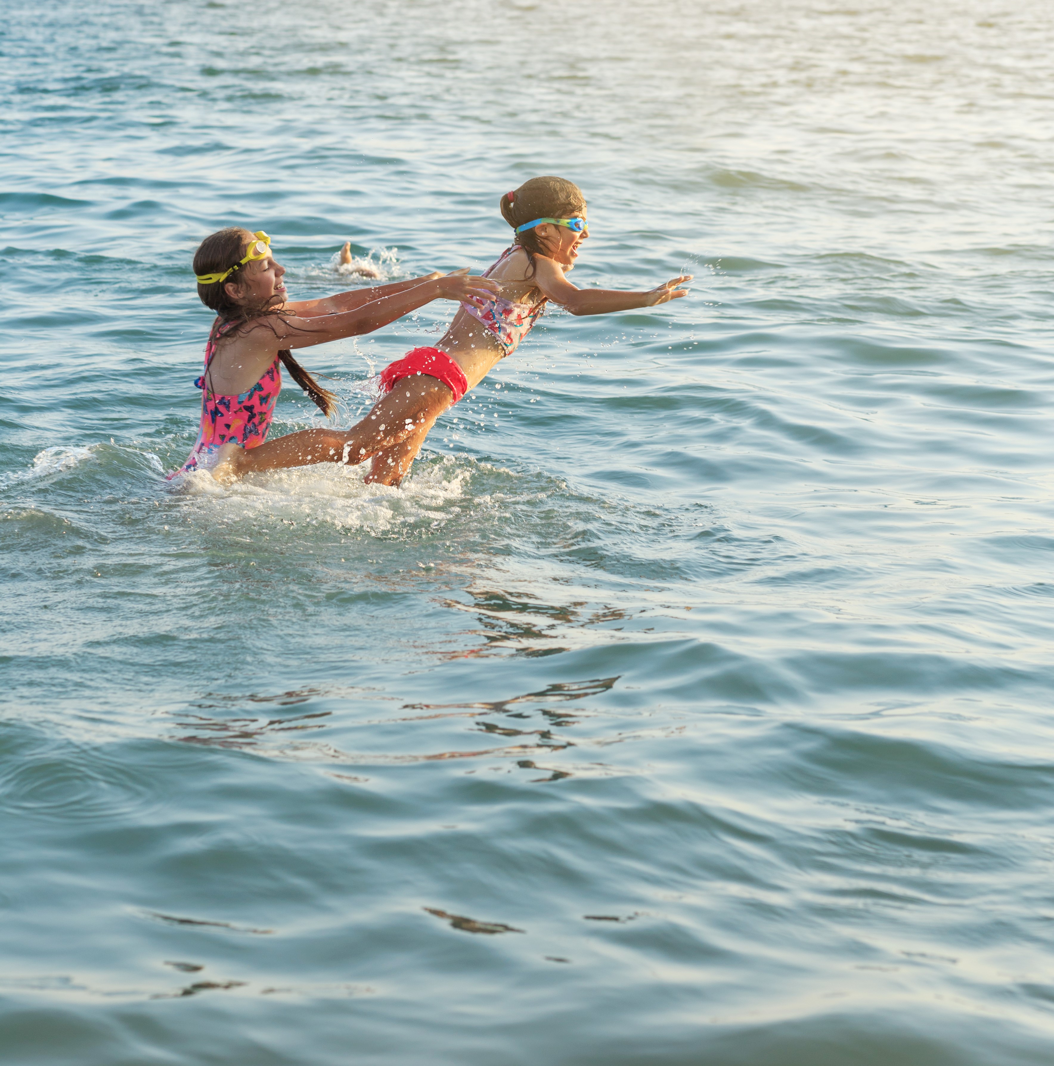 Two kids playing in the water